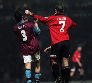 Images Dated 22nd January 1996: Erica Cantona of Manchester United pushes away West Hams Julian Dicks during the match