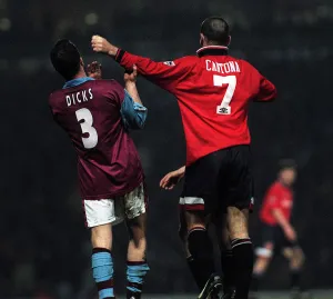 Erica Cantona of Manchester United pushes away West Hams Julian Dicks during the match Erica Cantona of Manchester United pushes away West Hams Julian Dicks during the match