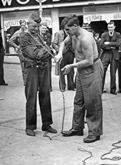 Escapologist demonstrating their skills in the Birmingham Bull Ring, West Midlands Escapologist demonstrating their skills in the Birmingham Bull Ring, West Midlands