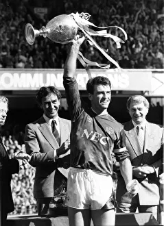 Everton captain Kevin Ratcliffe holds up the League Championship trophy after their 1-0 Everton captain Kevin Ratcliffe holds up the League Championship trophy after their 1-0