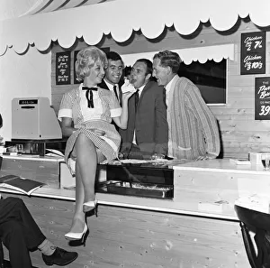 Everton football players Ray Wilson, Alex Scott and Sandy Brown being fed the house Everton football players Ray Wilson, Alex Scott and Sandy Brown being fed the house