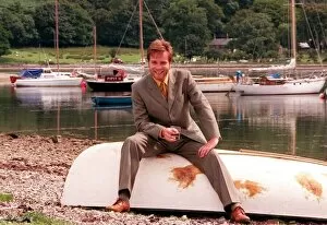 Images Dated 26th July 1998: Ewan McGregor on the Isle of Arran July 1998 with glass of Loch Ranza whisky sitting