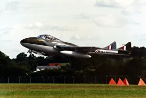An ex-RAF De Havilland Vampire T55 twin seat training aircraft taking off An ex-RAF De Havilland Vampire T55 twin seat training aircraft taking off