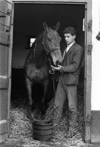 Famous racehorse Arkle with stable boy at the stables of Tom Dreaper Famous racehorse Arkle with stable boy at the stables of Tom Dreaper