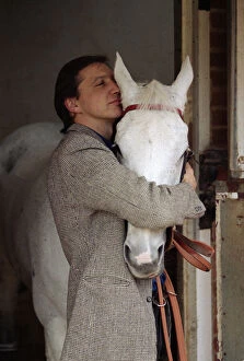 Images Dated 7th November 1989: Famous racehorse Desert Orchid in his stables with owner Richard Burridge