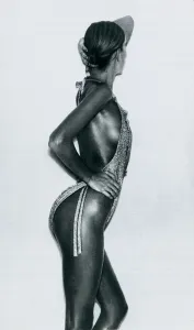 Fashion 1970s Model wearing a gold lurex swimsuit by Coveri for Tauche October 1976 Fashion 1970s Model wearing a gold lurex swimsuit by Coveri for Tauche October 1976