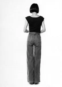Fashion - 1970s. Back of woman. Jeans and t-shirt. October 1975 P017333 Fashion - 1970s. Back of woman. Jeans and t-shirt. October 1975 P017333
