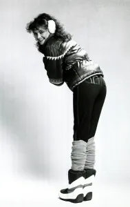 Fashion 1980s Model wearing stretch jeans, a quilted jacket, moon boots Fashion 1980s Model wearing stretch jeans, a quilted jacket, moon boots