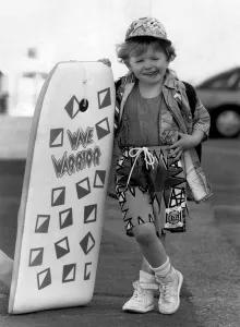 Fashion - Beachwear: Whizkid on the board. She's barely bigger then the board Fashion - Beachwear: Whizkid on the board. She's barely bigger then the board