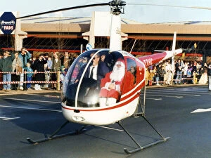 Images Dated 28th November 1992: Father Christmas arriving in style, in a helicopter at the car park of Homestyle by FADS