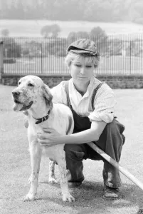 Felicity Kendal dressed as a gardener with a dog July 1982 whilst filming a new Felicity Kendal dressed as a gardener with a dog July 1982 whilst filming a new