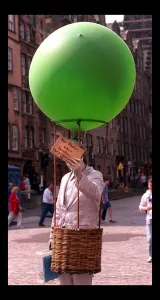 Some of the festival goers in edinburgh August 1998 Man holding green balloon Some of the festival goers in edinburgh August 1998 Man holding green balloon