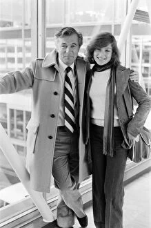Images Dated 13th October 1977: Film producer Bryan Forbes and actress Tatum O Neal leaving Heathrow Airport for