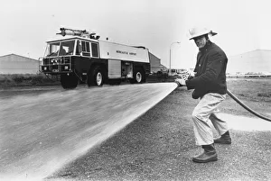 Fireman Bob Ford with the new fire engine at Newcastle Airport Fireman Bob Ford with the new fire engine at Newcastle Airport