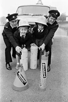 Images Dated 4th November 1985: Firemen Geoff Sykes (left) and Mick Senior spell out a Bonfire Night fire safety message