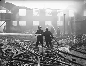 Firemen seen here dampening down fires in the Holbrooks area of Coventry following Firemen seen here dampening down fires in the Holbrooks area of Coventry following
