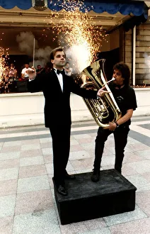 Fireworks director Wilf Scott plays a tuba in front of orchestra conductor Christopher Fireworks director Wilf Scott plays a tuba in front of orchestra conductor Christopher