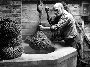 A fisherman with nets full of shellfish January 1945 A fisherman with nets full of shellfish January 1945