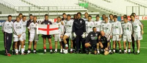 Football - England's manager Glenn Hoddle holds the England flag Football - England's manager Glenn Hoddle holds the England flag