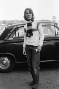 A football supporter outside the ground before a match, wearing the colours of his team A football supporter outside the ground before a match, wearing the colours of his team