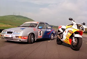 Ford Sierra Cosworth in racing trim with a Honda motorbike. July 1999 Ford Sierra Cosworth in racing trim with a Honda motorbike. July 1999