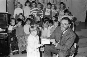 Four-year-old Emily Sylvester presents a £300 cheque to National Society for Four-year-old Emily Sylvester presents a £300 cheque to National Society for