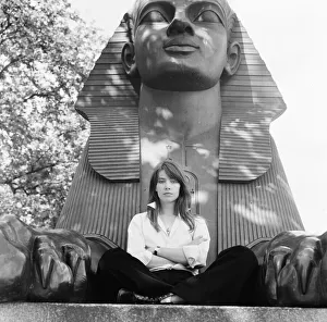 Francoise Hardy, french singer pictured seated between the feet of a sphinx Francoise Hardy, french singer pictured seated between the feet of a sphinx