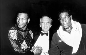 Images Dated 12th August 1988: Frank Bruno Boxing and Mike Tyson shake hands watched over by promoter Micky Duff