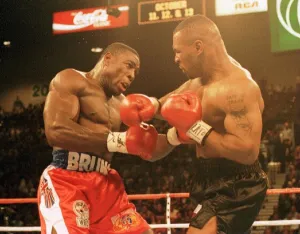 Frank Bruno and Mike Tyson battle it out during the WBC world title fight in Las Vegas Frank Bruno and Mike Tyson battle it out during the WBC world title fight in Las Vegas