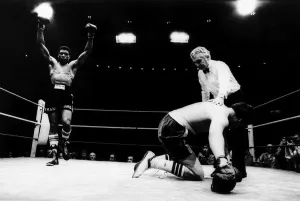 Frank Bruno signals triumph in the first round of his professional debut at the Albert Frank Bruno signals triumph in the first round of his professional debut at the Albert