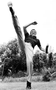 Frankie Vaughan singer and entertainer May 1974 kicking foot high up in air Frankie Vaughan singer and entertainer May 1974 kicking foot high up in air