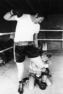 Freddie Starr biting the leg of Dick Richardson his road manager Freddie Starr biting the leg of Dick Richardson his road manager