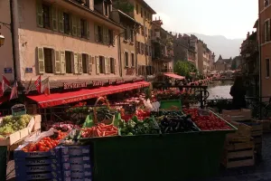 Fruit and Vegetables in the street market overlooking the River running through the town Fruit and Vegetables in the street market overlooking the River running through the town