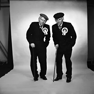 Fulham footballers Bobby Moore (left) and Alan Mullery dressed in suits and make-up Fulham footballers Bobby Moore (left) and Alan Mullery dressed in suits and make-up