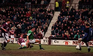 Gary MacKay Hearts football player scores goal past Hibs keeper Jim Leighton Gary MacKay Hearts football player scores goal past Hibs keeper Jim Leighton