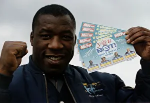 Gary Mason Boxing Heavywieght boxer holding up Daily Mirror You Bet game cards Gary Mason Boxing Heavywieght boxer holding up Daily Mirror You Bet game cards