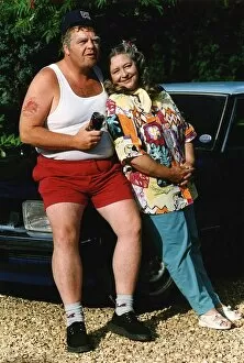 Images Dated 10th August 1992: Geoffrey Hughes actor sitting on car bonnet