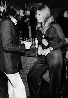 Images Dated 21st January 1974: George Best with American girl Marjorie Wallace, Miss World at his Slack Alice night club