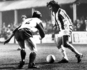 George Best takes on Jim Melrose in a first-half move during the Nuneaton Borough charity George Best takes on Jim Melrose in a first-half move during the Nuneaton Borough charity