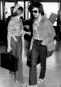 George Harrison at Heathrow Airport today with his wife Patti Boyd. November 1973 P003740 George Harrison at Heathrow Airport today with his wife Patti Boyd. November 1973 P003740