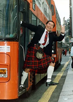 George Takei July 1992 stepping off a bus, wearing traditional Scottish clothing George Takei July 1992 stepping off a bus, wearing traditional Scottish clothing