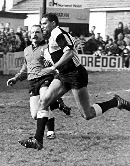 Gerald Cordle the Cardiff Winger goes through the Llanharen defence to score Cardiff' Gerald Cordle the Cardiff Winger goes through the Llanharen defence to score Cardiff'