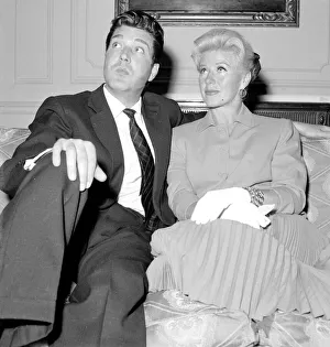 Ginger Rogers with David Hughes sitting on a couch May 1959 Ginger Rogers with David Hughes sitting on a couch May 1959