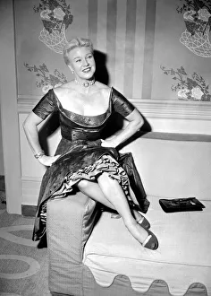 Ginger Rogers in the UK with her hands on her hips Ginger Rogers in the UK with her hands on her hips