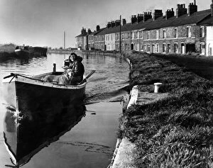 Images Dated 22nd January 1974: A girl and her dog on a peaceful boat trip on the Leeds and Liverpool canal near Ormskirk
