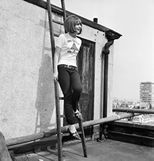 Girl wearing the latest teenage fashion fad - a Radio Caroline sweater - is Christine Girl wearing the latest teenage fashion fad - a Radio Caroline sweater - is Christine