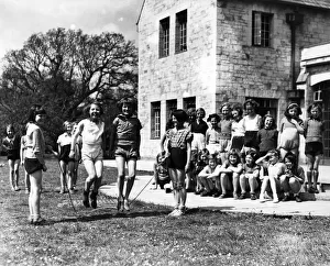 Girls skipping outside on the front lawn. Circa 1950 P012106 Girls skipping outside on the front lawn. Circa 1950 P012106