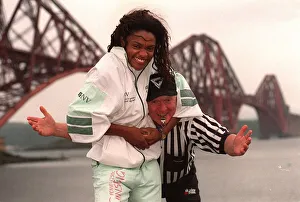 Gladiator Rocket ( Pauline Richards) gets a head lock on referee John Anderson with Gladiator Rocket ( Pauline Richards) gets a head lock on referee John Anderson with