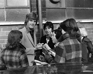 Gordon McQueen signs autographs for young fans outside Old Trafford, Manchester Gordon McQueen signs autographs for young fans outside Old Trafford, Manchester