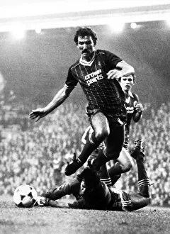 Graeme Souness of Liverpool jumps over Brighton goalkeeper Graham Mosely during the two Graeme Souness of Liverpool jumps over Brighton goalkeeper Graham Mosely during the two